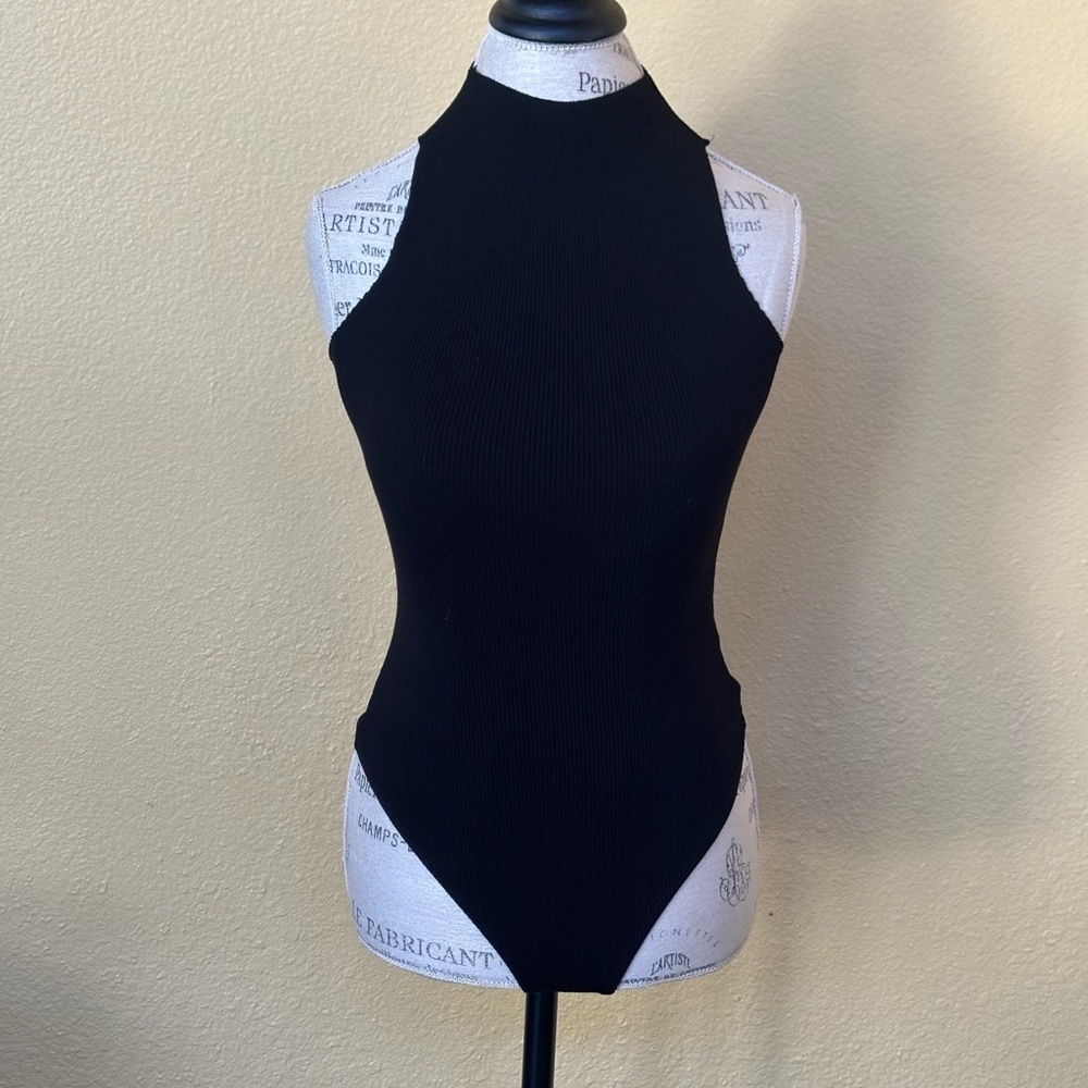 Naked Wardrobe Sleeveless Mock Turtleneck Bodysuit in Black